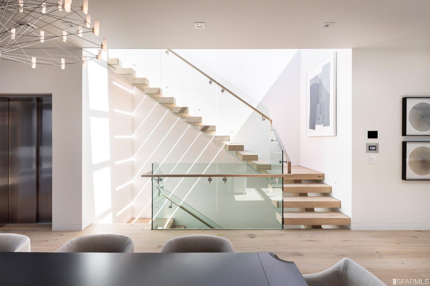 Stairway with glass banister