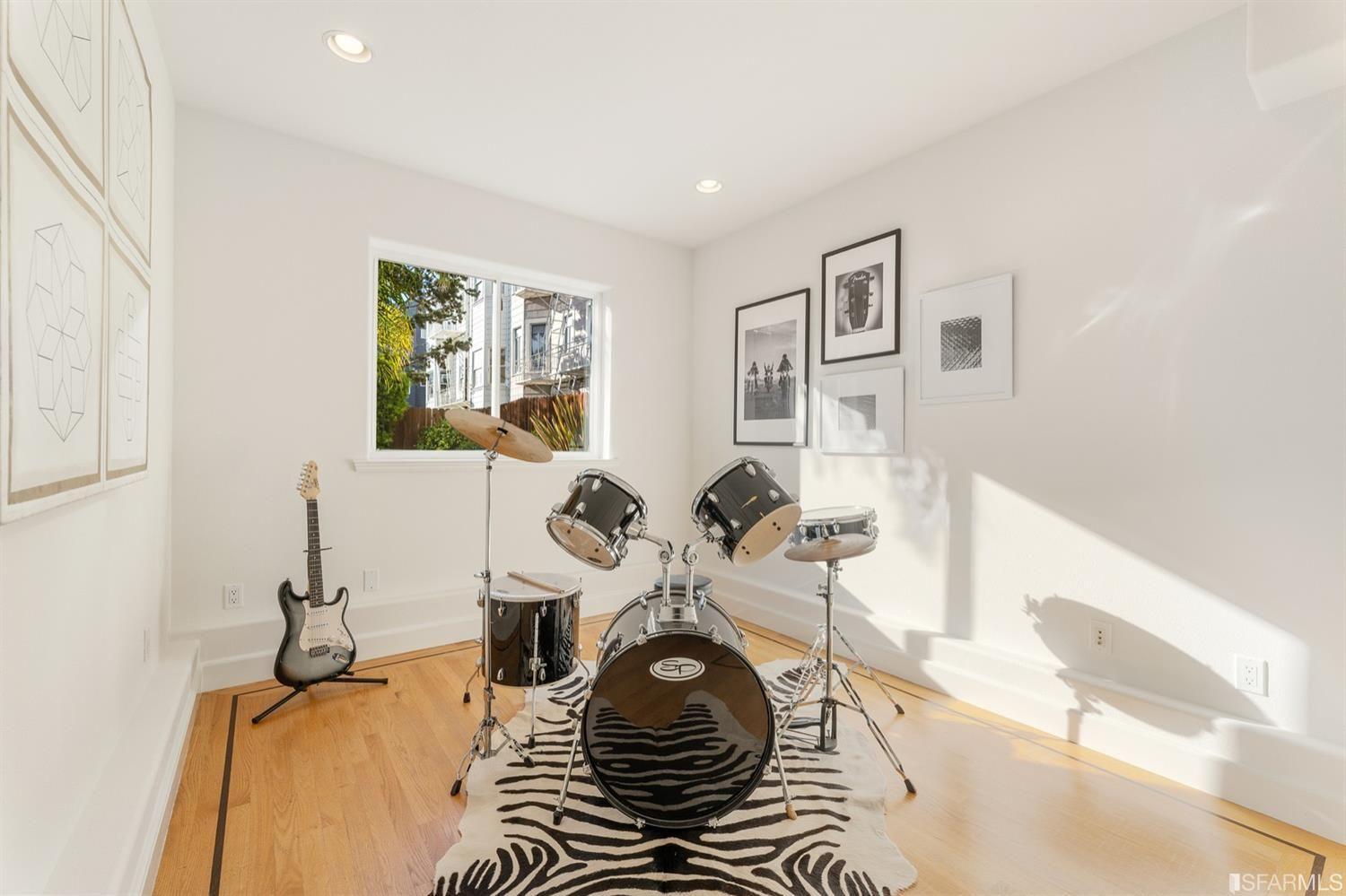217-219 16th Avenue Music room with drum set and guitar. 